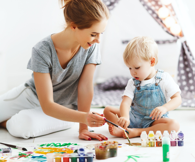 nanny painting with toddler